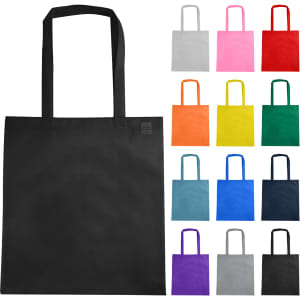 A black non-woven reusable grocery bag with long handles, surrounded by bags in various colours including grey, pink, red, and blue.