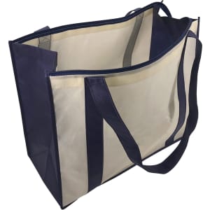 A large zipped shopping bag in navy and cream, featuring two sturdy handles and an internal zipped pocket.