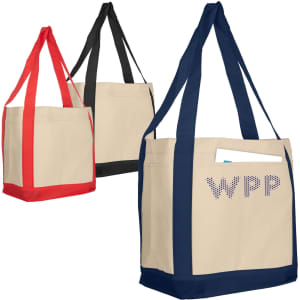 A set of three non-woven larger shopper bags in red, black, and navy, featuring a front pocket and a logo.