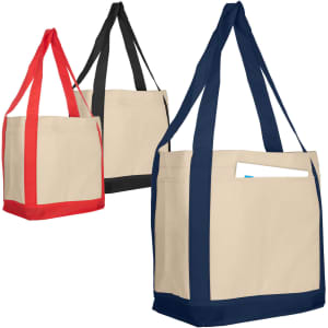 A tan reusable grocery bag in red, black, and navy, featuring handles and a pocket, with a logo on the side.