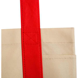 A cream reusable grocery bag with a red handle, featuring a pocket on one side and a logo.