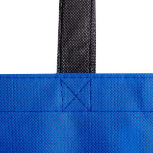 A reusable grocery bag in blue with black handles, featuring a texture pattern and stitching details. It has a logo.