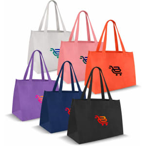 A collection of medium non-woven tote bags in various colours: grey, pink, orange, purple, and black, each with a logo.