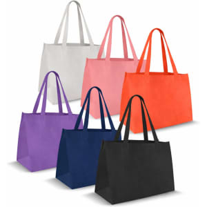 A collection of medium non-woven tote bags in white, pink, orange, purple, navy, and black, featuring various handles and designs.