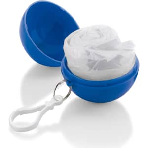 A blue container with a keychain holds a rolled-up white poncho inside. The container has a glossy finish.