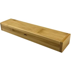 A bamboo pen gift box with a smooth finish and sliding closure. It features natural wood tones and a minimalistic design.