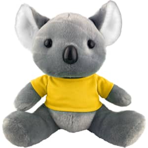A grey koala plush toy wearing a yellow shirt, featuring large ears and button-like eyes. It has a logo on its shirt.