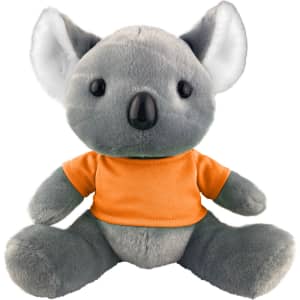 A grey koala plush toy wearing an orange shirt, with large ears and a rounded body, featuring a small logo.