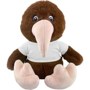 A brown kiwi plush toy with a pink beak and feet, wearing a white T-shirt. It has large eyes and a friendly expression.