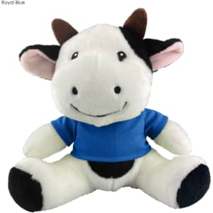 A plush cow toy with a smiling face, wearing a blue shirt, featuring black and white colouring, and brown horns.