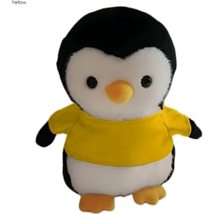 A plush penguin toy in black and white, wearing a yellow shirt, with large expressive eyes. It has a small orange beak.