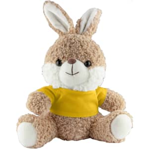 A fluffy brown rabbit plush toy with a white face and ears, wearing a yellow shirt. It has a cute, smiling expression.