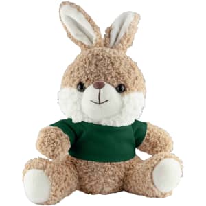 A plush rabbit in light brown with a green shirt, featuring fluffy ears and a friendly expression. It has a logo.