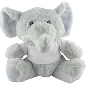 A grey elephant plush toy with large ears and a small white T-shirt, sitting upright. It has a soft and cuddly appearance.