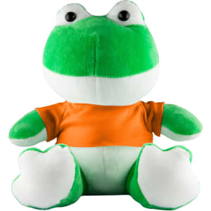 A green frog plush toy wearing an orange shirt, with large eyes and a soft texture. The toy has white underparts.