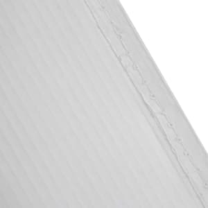 A plain white paper bag with a ribbed texture and visible stitching along the edge.