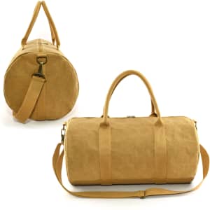 A kraft paper duffle bag in a warm golden brown colour, featuring twin handles and a detachable shoulder strap.