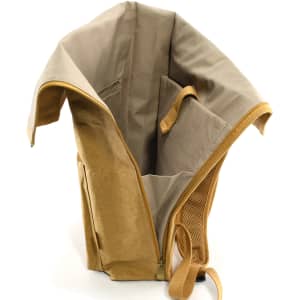 A kraft paper laptop backpack in tan and beige, featuring a spacious interior and a logo.
