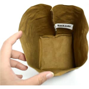 A medium-sized, brown kraft paper storage bag with a rectangular base and a label inside.