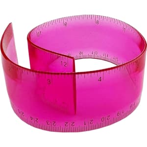 A pink PVC soft plastic ruler, flexible and marked with measurement increments, featuring a logo on the surface.