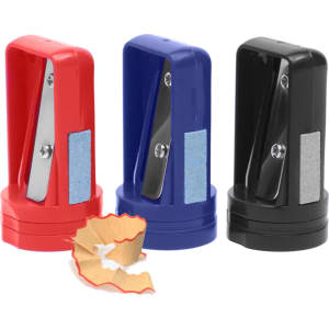 Three pencil sharpeners in red, blue, and black, with shavings in front of them. Each has a logo on its side.