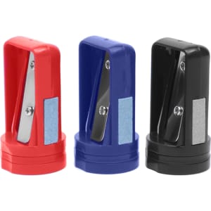 A set of three pencil sharpeners in red, blue, and black, featuring a metallic blade and a small grip area.