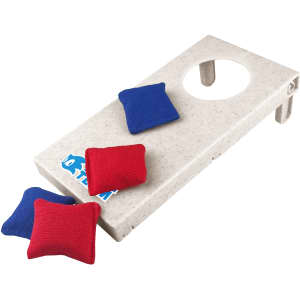 A Wheat Straw Cornhole board in light beige with a hole, accompanied by red and blue bean bags.