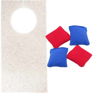 Wheat straw cornhole board in white with a circular hole, accompanied by red and blue bean bags.