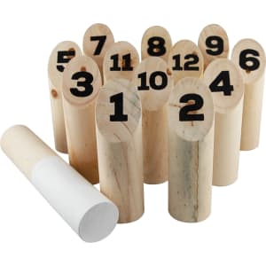 A set of wooden skittles numbered 1 to 12, with a white throwing object beside them.