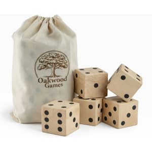 A set of five wooden yard dice in a natural fabric bag, featuring black dots and a logo.