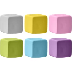 A set of six rubber cube erasers in grey, yellow, pink, green, blue, and purple. Each has a smooth surface and a logo.