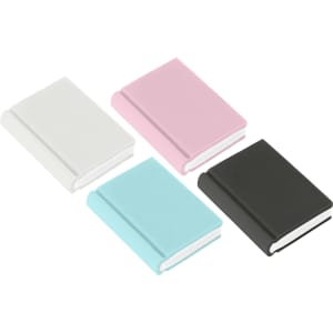 A collection of book-shaped rubber erasers in white, pink, light blue, and black. Each eraser resembles a small book.
