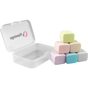A clear box containing six pastel-coloured rubber erasers shaped like cubes. The box is partially open.