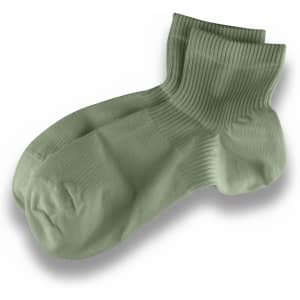 A pair of light green ribbed socks with a crew length design, featuring a logo.