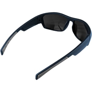 Sunglasses in black with grey accents. Features a modern design and tinted lenses. Logo present on the frame.