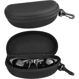A black hard-shell glasses case with a zippered opening, containing a pair of sunglasses inside. It has a clip for attachment.