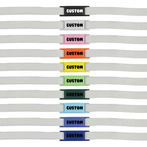 A row of white shoelaces featuring various coloured luxury shoelace charms in multiple designs and shades.