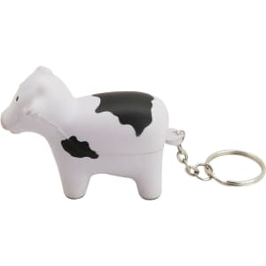 A stress cow key ring in white with black spots, featuring a silver metal chain for attachment.