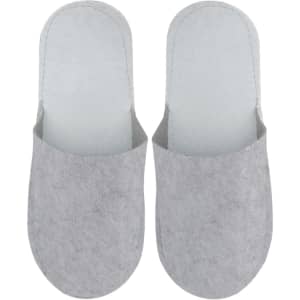Felt slippers in light grey with a simple design and soft texture, featuring a logo on one slipper.