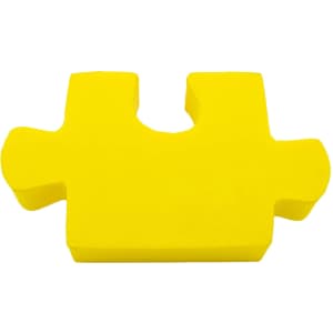 A bright yellow jigsaw piece shaped stress reliever with a smooth, soft texture.