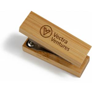 A bamboo stapler with a wooden finish and a silver stapling mechanism, featuring a logo on the surface.