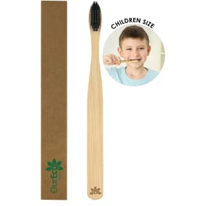 A bamboo toothbrush for kids in natural wood tones, packaged in a brown rectangular box with a logo.
