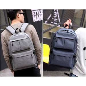 A grey and navy blue laptop backpack featuring multiple compartments and adjustable straps, with a logo on the front.