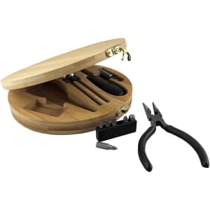 A round bamboo toolkit featuring pliers, screwdrivers, and bits, with a hinged lid and a logo.