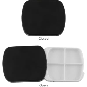 A black pill box with a smooth surface, open to reveal four compartments inside. It has a logo on the exterior.