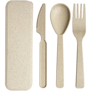 A set of beige wheat straw utensils including a knife, spoon, and fork, housed in a matching case.