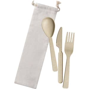 Wheat straw cutlery set including a spoon, fork, and knife in a cream fabric bag.