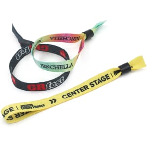 Three event wristbands in various colours, including yellow, black, and multi-coloured options, featuring logos.