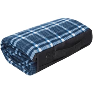 A folded blue and white checked picnic rug with a black trim and a carrying handle.