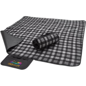 A black and grey checkered picnic rug, rolled up on one side, with a fabric logo patch visible.